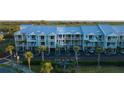 Exterior shot of a beautiful condo complex with lovely pastel colors and balconies at 3210 Mangrove Point Dr, Ruskin, FL 33570
