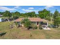 Charming single-Gathering home with a covered porch and a spacious yard, perfect for outdoor activities at 4615 Keene Rd, Plant City, FL 33565