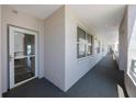 Well-lit hallway with windows and neutral color palette at 8020 Sailboat Key S Blvd # 101, St Pete Beach, FL 33707