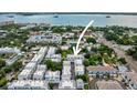 Aerial view of a neighborhood with the ocean in the background, showcasing community and prime location at 946 Highland Ave # 23, Dunedin, FL 34698