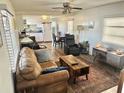 Inviting living room with wood floors, comfortable seating, and lots of natural light at 9790 66Th N St # 346, Pinellas Park, FL 33782