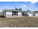 Single-story home showcasing the house number, window shutters, and classic details at 11422 Yellowwood Ln, Port Richey, FL 34668