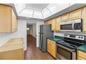 Bright kitchen featuring stainless steel appliances and ample cabinet space at 131 Bluff View Dr # 101, Belleair Bluffs, FL 33770