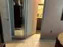 View of the bathroom with tiled flooring and cabinets with mirrors at 1312 Foxboro Dr., Brandon, FL 33511