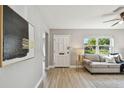 Cozy living room with wood-look flooring, neutral paint, and a comfortable seating area at 1775 Michigan Ne Ave, St Petersburg, FL 33703