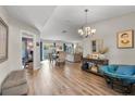 Spacious living area featuring hardwood floors, stylish decor, and plenty of natural light at 1849 Diane Dr, Clearwater, FL 33759