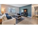 Comfortable living room with modern furnishings and a flat-screen television at 2808 W Lake Ave, Tampa, FL 33607