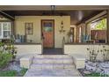 Inviting front porch with cozy seating and decorative details at 307 Bay St, Tarpon Springs, FL 34689