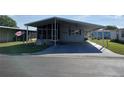 Charming home with a covered parking area and well-maintained landscaping at 3114 Briar St. St, Wesley Chapel, FL 33543