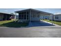 Inviting home with covered parking and neat landscaping at 3114 Briar St. St, Wesley Chapel, FL 33543
