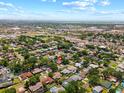 Broad aerial view pinpointing the property within a well-established neighborhood near commercial areas and roadways at 6470 28Th N Ter, St Petersburg, FL 33710