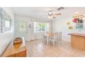 Bright dining area with tiled floors and a view of the front yard at 700 16Th Nw St, Largo, FL 33770