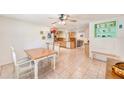 Spacious dining room seamlessly connects to an open kitchen area at 700 16Th Nw St, Largo, FL 33770