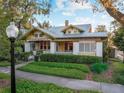 Charming yellow home with a well maintained yard, and a metal roof at 701 S Boulevard, Tampa, FL 33606