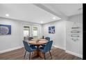 Charming dining room with wood floors, patio access, and stylish nautical-themed decor at 7202 8Th N Ave, St Petersburg, FL 33710