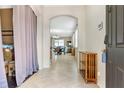 Bright foyer leading into an open-concept living and dining area at 11638 Palmetto Pine St, Riverview, FL 33569