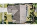 Overhead view of the home, backyard, screened in porch and surrounding neighborhood at 1506 Lakehurst Way, Brandon, FL 33511