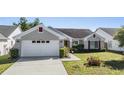 Charming single-story home with well-maintained lawn and beautiful landscaping at 1506 Lakehurst Way, Brandon, FL 33511