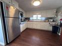 Efficient kitchen featuring updated appliances, ample cabinetry, and a bright window overlooking the sink at 2331 Belleair Rd # 904, Clearwater, FL 33764