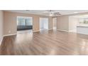 Spacious living room with sleek flooring and natural light at 2529 Lancaster Dr, Sun City Center, FL 33573