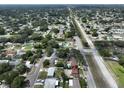 Aerial view of a property with a nice backyard and mature trees in a residential area at 3491 58Th N St, St Petersburg, FL 33710