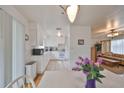 Cozy kitchen and dining area with white appliances and wood flooring at 3491 58Th N St, St Petersburg, FL 33710