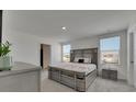 Sunlit main bedroom with neutral decor and stylish furnishings at 35260 Spruce Knob Ct, Dade City, FL 33525