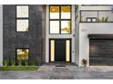 Modern home with a sleek front door, well-lit entry, and neatly manicured landscaping at 3604 W El Prado Blvd, Tampa, FL 33629