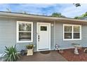 Charming front entryway with a cozy porch and fresh landscaping at 4414 W El Prado Blvd, Tampa, FL 33629