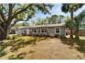 Well-maintained single-story home with lush lawn and neat flower bed landscaping at 4414 W El Prado Blvd, Tampa, FL 33629