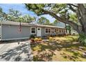 Inviting single-story home with a tidy lawn and landscaped flower beds at 4414 W El Prado Blvd, Tampa, FL 33629