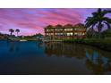 Picturesque waterfront views featuring multi-story residences, private docks, and stunning sunset skies at 47 W Morgan St, Tarpon Springs, FL 34689