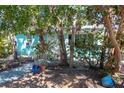 This yard is a quiet, shady space shaded by a few trees and featuring a brick walkway at 515 77Th Ave, St Pete Beach, FL 33706