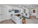 Bright living room with neutral walls, wood floors, and comfortable seating at 5833 Dartmouth N Ave, St Petersburg, FL 33710