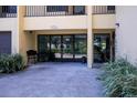 Well-maintained building entrance with glass doors and a comfortable sitting area at 5849 Park N St # 308, St Petersburg, FL 33709