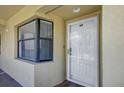 Private front entrance with a window and a white front door at 5849 Park N St # 308, St Petersburg, FL 33709