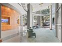 Impressive lobby featuring expansive windows, comfortable seating, and contemporary design at 777 N Ashley Dr # 2807, Tampa, FL 33602