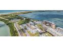 Aerial view of the building showing proximity to the bay and surrounding community at 9 Forbes Pl # 504, Dunedin, FL 34698