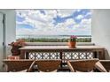 Balcony with seating and a table for enjoying the views of the bay at 9 Forbes Pl # 504, Dunedin, FL 34698