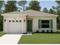 Charming single-story home with a well-manicured lawn, a garage, and a vibrant green front door at 9002 Glenarm Way, Spring Hill, FL 34613