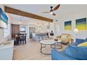 Spacious living room with a modern open floor plan that integrates a dining area and gourmet kitchen at 125 11Th Ave, Indian Rocks Beach, FL 33785