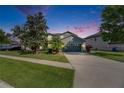 Charming two-story home with a well-maintained lawn and a spacious two-car garage at 18734 Burndall Ct, Land O Lakes, FL 34638
