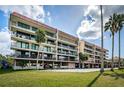 Spacious condo building featuring multiple balconies and covered parking at 2700 Bayshore Blvd # 9209, Dunedin, FL 34698