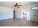 Bright living room with wood floors and a view into the kitchen at 2936 39Th N Ave, St Petersburg, FL 33714