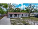Charming single-story home features a covered porch and well-maintained front yard at 3407 N 48Th St, Tampa, FL 33605