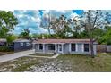 Charming single-story home features a covered porch and well-maintained front yard at 3407 N 48Th St, Tampa, FL 33605