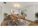 Charming dining room with hardwood floors, modern light fixture, and buffet at 615 14Th Ne Ave, St Petersburg, FL 33701