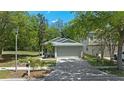 Charming single-story home with a well-manicured lawn and a two-car garage, offering great curb appeal at 7816 Citrus Blossom Dr, Land O Lakes, FL 34637