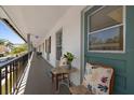 Relaxing balcony with seating, showcasing the outdoor living space at 100 Glennes Ln # 207, Dunedin, FL 34698