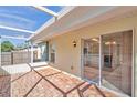 Screened-in brick patio with sliding glass doors providing seamless indoor-outdoor living at 11817 Mango Cross Ct, Seffner, FL 33584